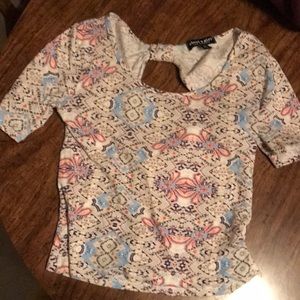 Women’s patterned tee with open back.